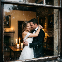Couple embracing, bride and groom